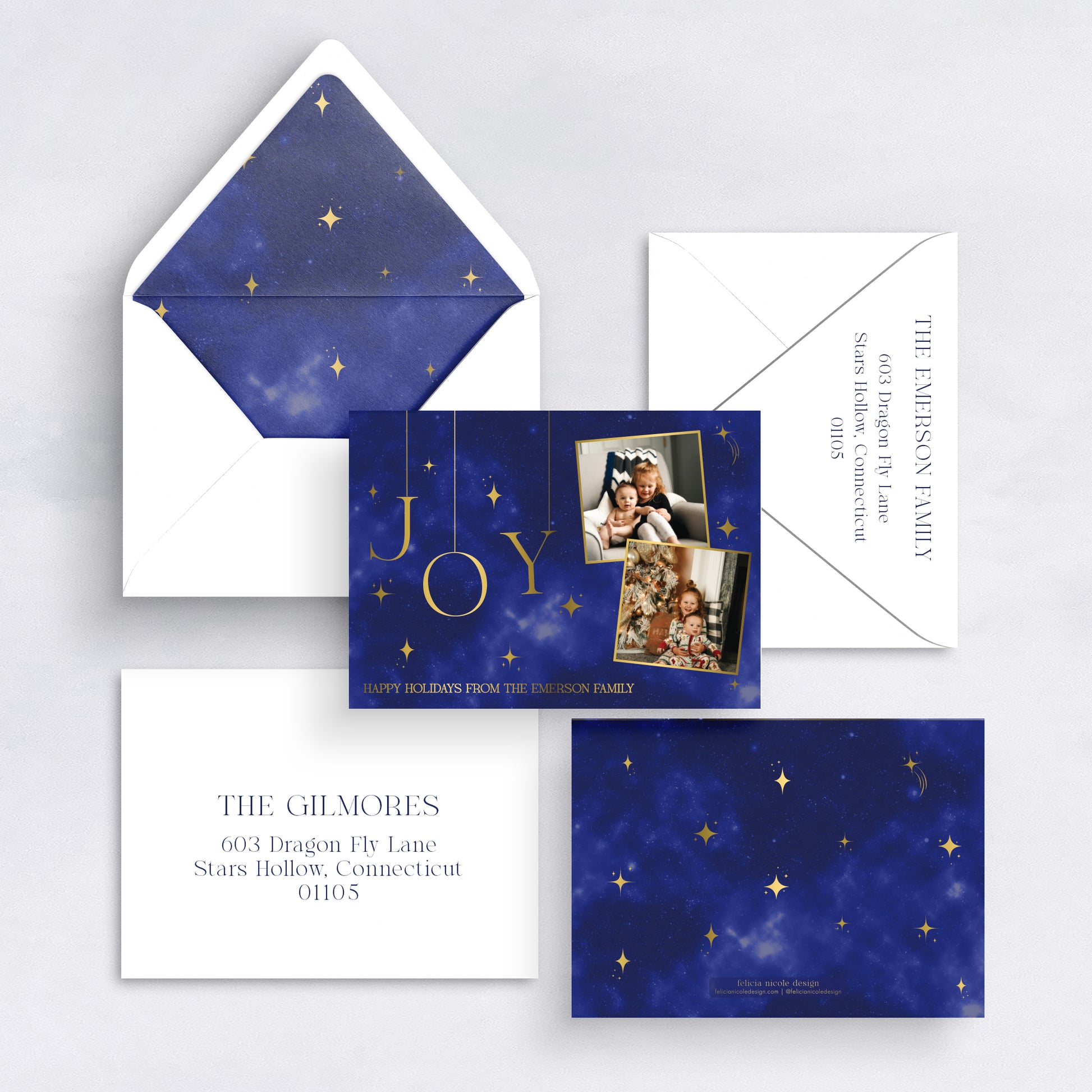 Navy blue celestial Christmas card with gold stars and family photos, paired with matching envelope liner.