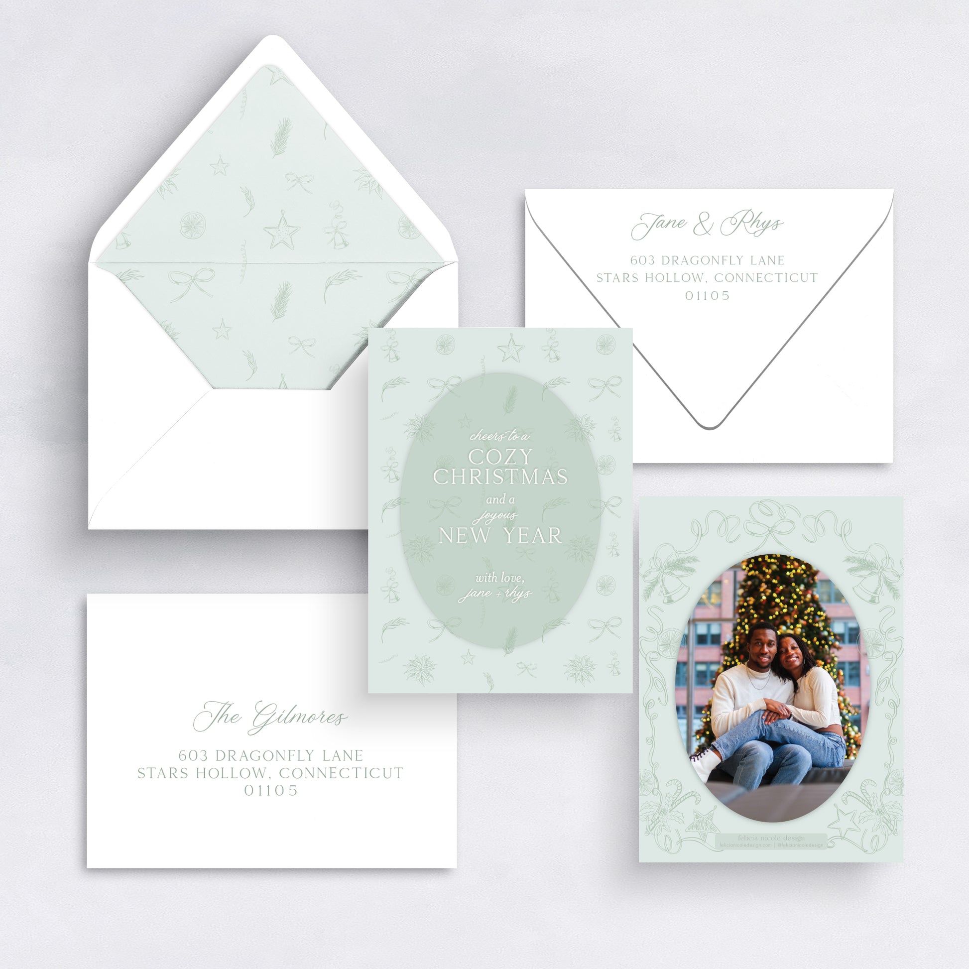 Mint green Cozy Christmas card with illustrated frame and couple’s holiday photo.