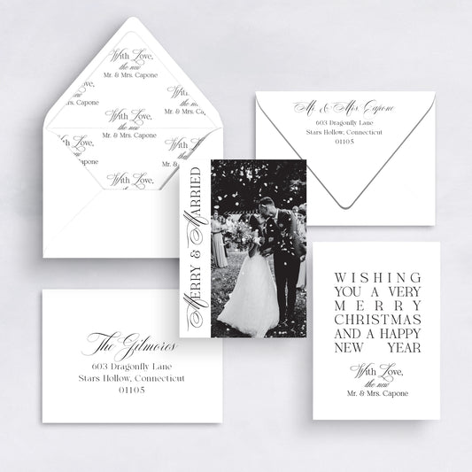 Black and white Merry & Married vertical Christmas card with couple photo and elegant typography.