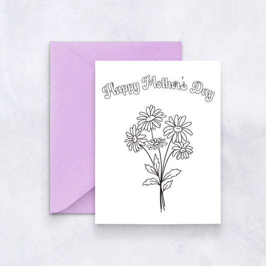 White greeting card with outlined daisies and text reading “Happy Mother’s Day,” styled with a lavender envelope.