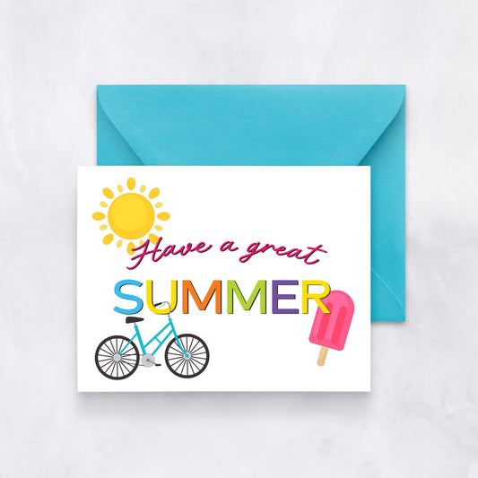White card with bright illustrations of a sun, popsicle, and bike and text reading “Have a great summer,” paired with a turquoise envelope.