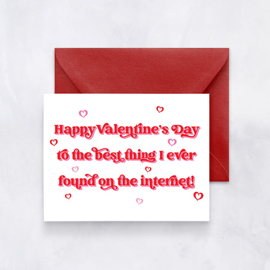 White card with bold red and pink text reading “Happy Valentine’s Day to the best thing I ever found on the internet,” paired with a red envelope.