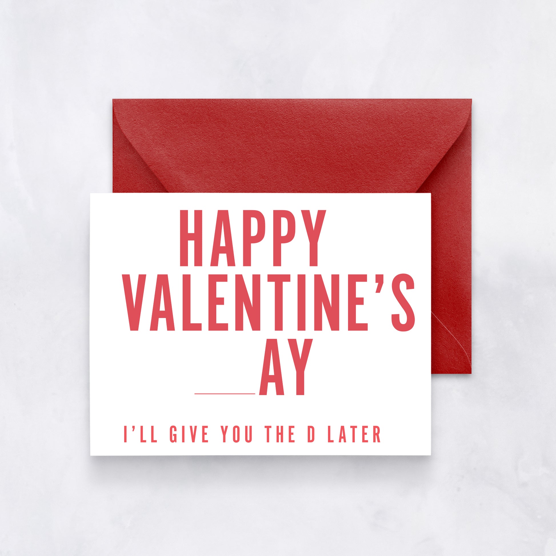 White card with red text reading “Happy Valentine’s _ay – I’ll give you the D later,” paired with a red envelope.