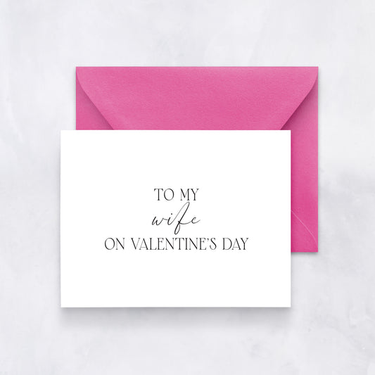 White card with elegant black script reading “To my wife on Valentine’s Day,” paired with a pink envelope.