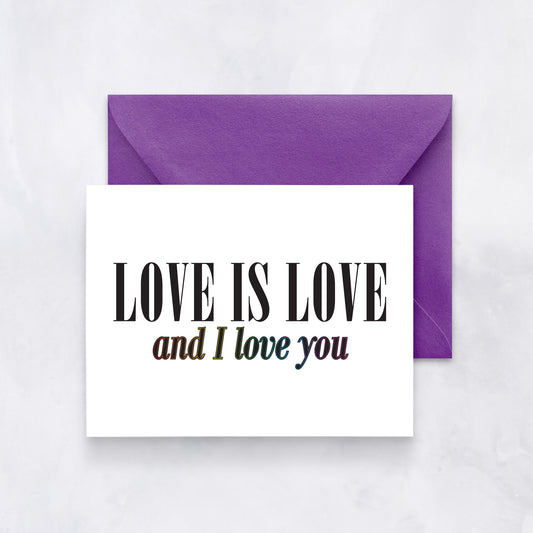 White card with bold black and rainbow text reading “Love is love and I love you,” styled with a purple envelope.