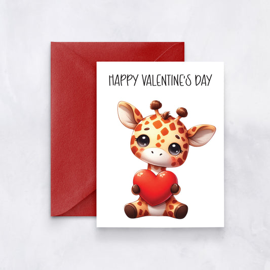 White card with illustrated giraffe holding red heart and text “Happy Valentine’s Day,” styled with a red envelope.