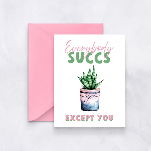 White card with watercolor succulent in pink pot, text reads “Everybody succs except you,” styled with a pink envelope.
